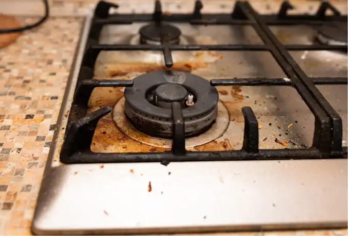 Greasy gas stovetop before cleaning